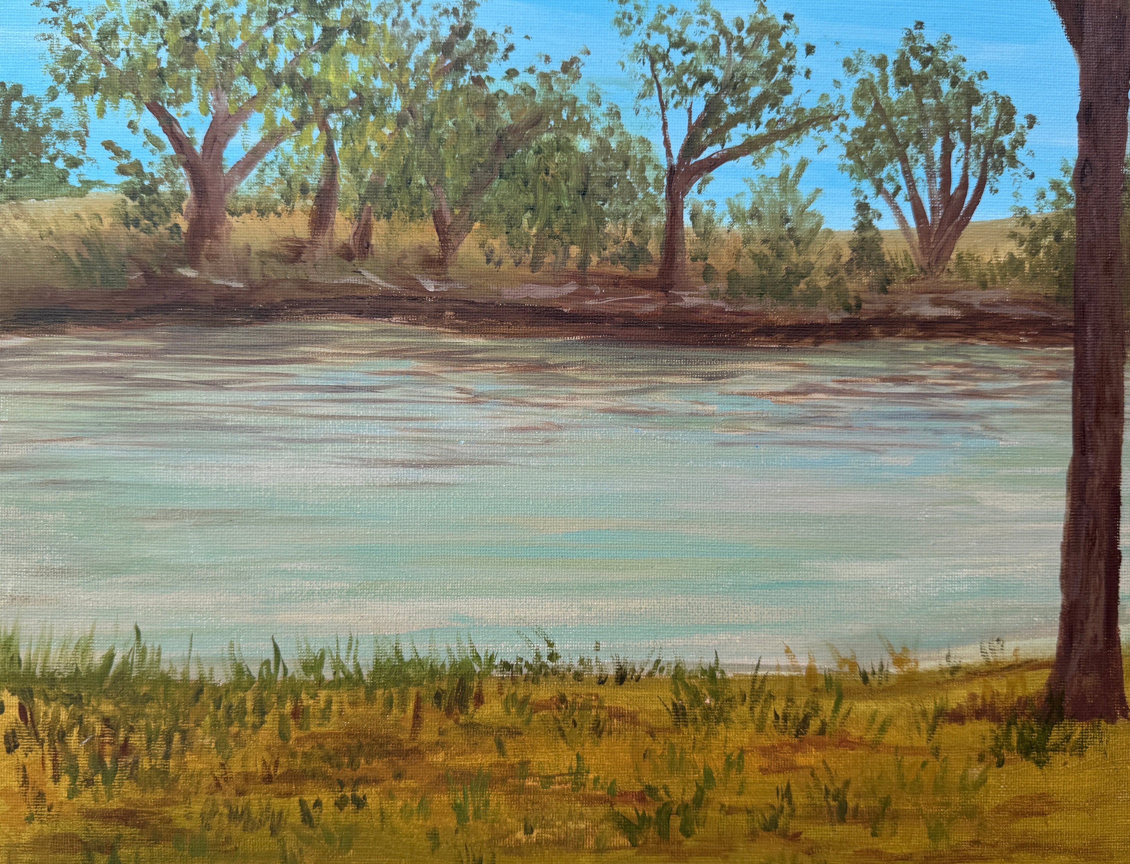 Painting of a landscape with trees and water on a stone surface