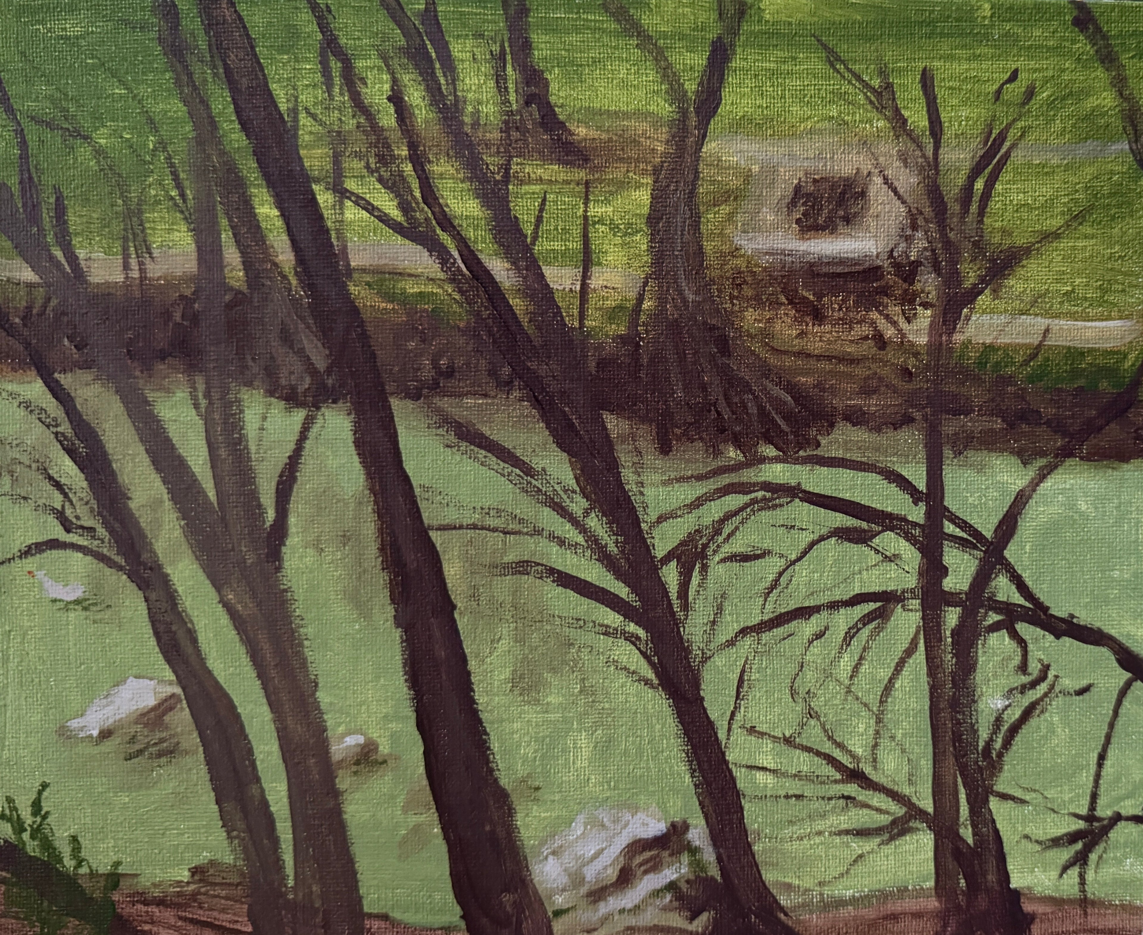 Small painting of a forest scene on a stone surface